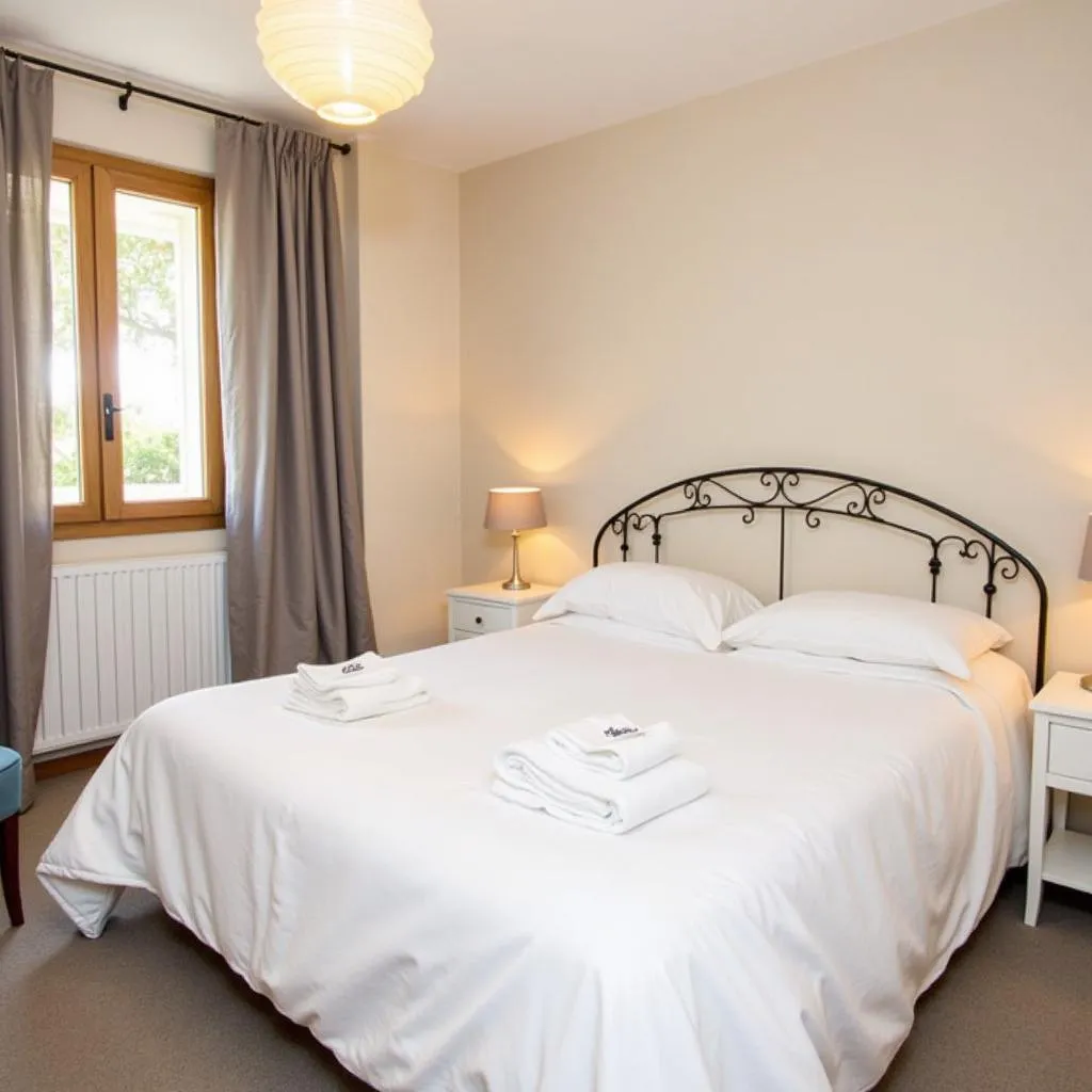 Inviting bedroom in a &quot;me Stay in Spain&quot; homestay featuring a Zara Home white duvet cover