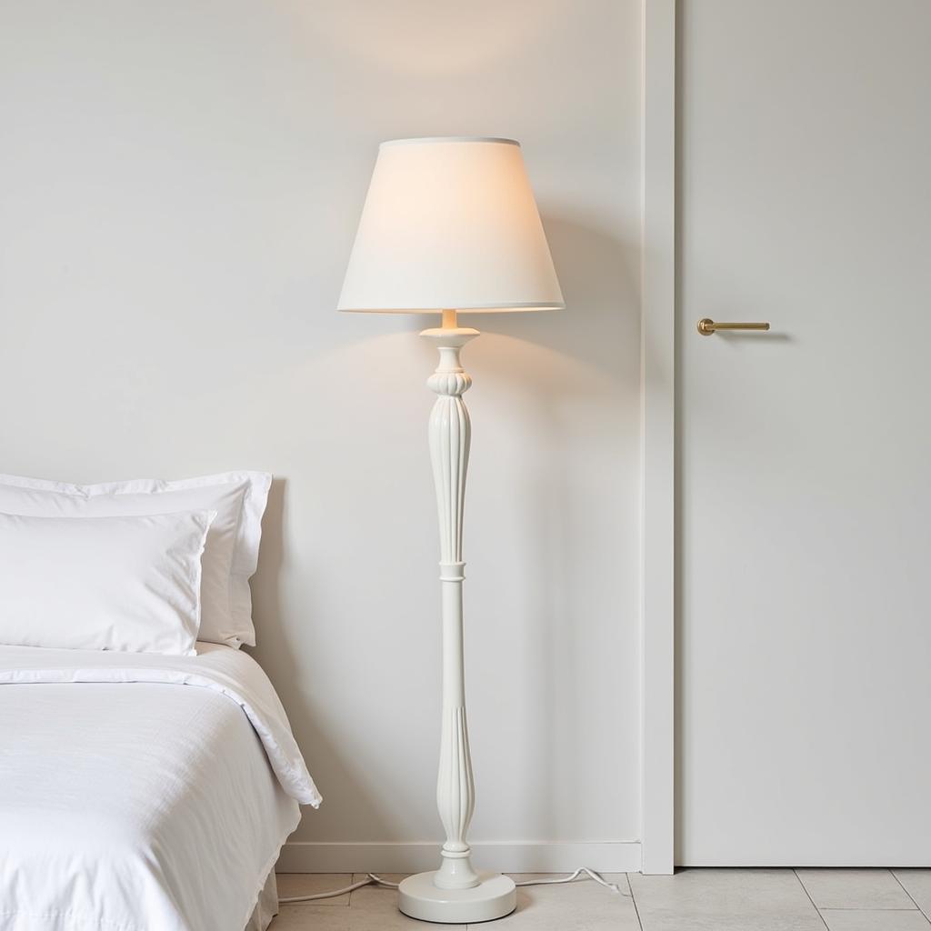 Elegant bedroom illuminated by a Zara Home floor lamp