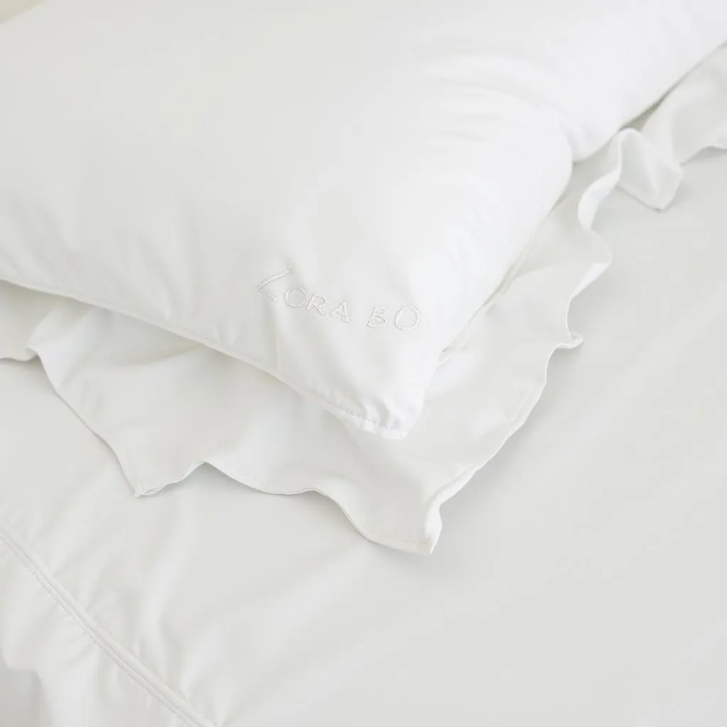 Close-up of the intricate details on a Zara Home white duvet cover