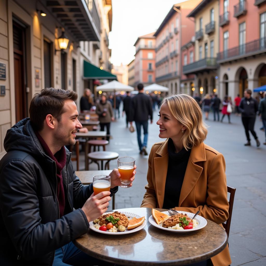 Couple enjoying tapas in Plaza Mayor during their homestay in Madrid