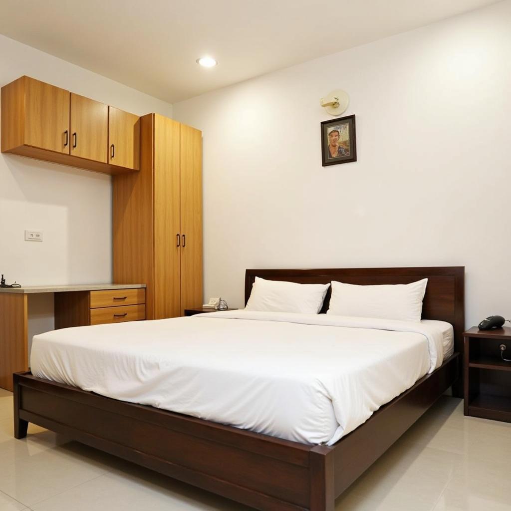 Clean and comfortable bedroom in a budget homestay in South Delhi