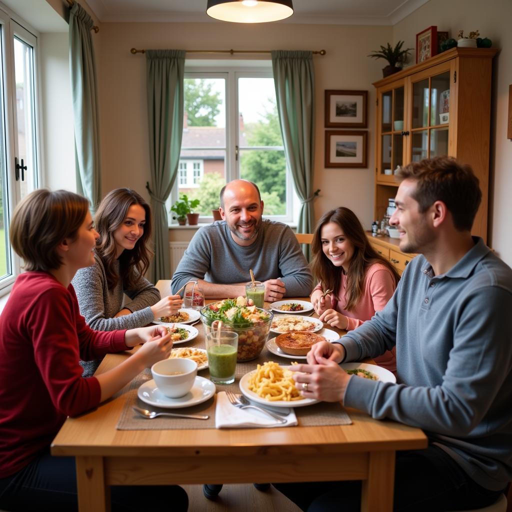 Happy homestay family in England enjoying a meal together.